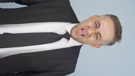 Vertical-video-of-Yawning-businessman.